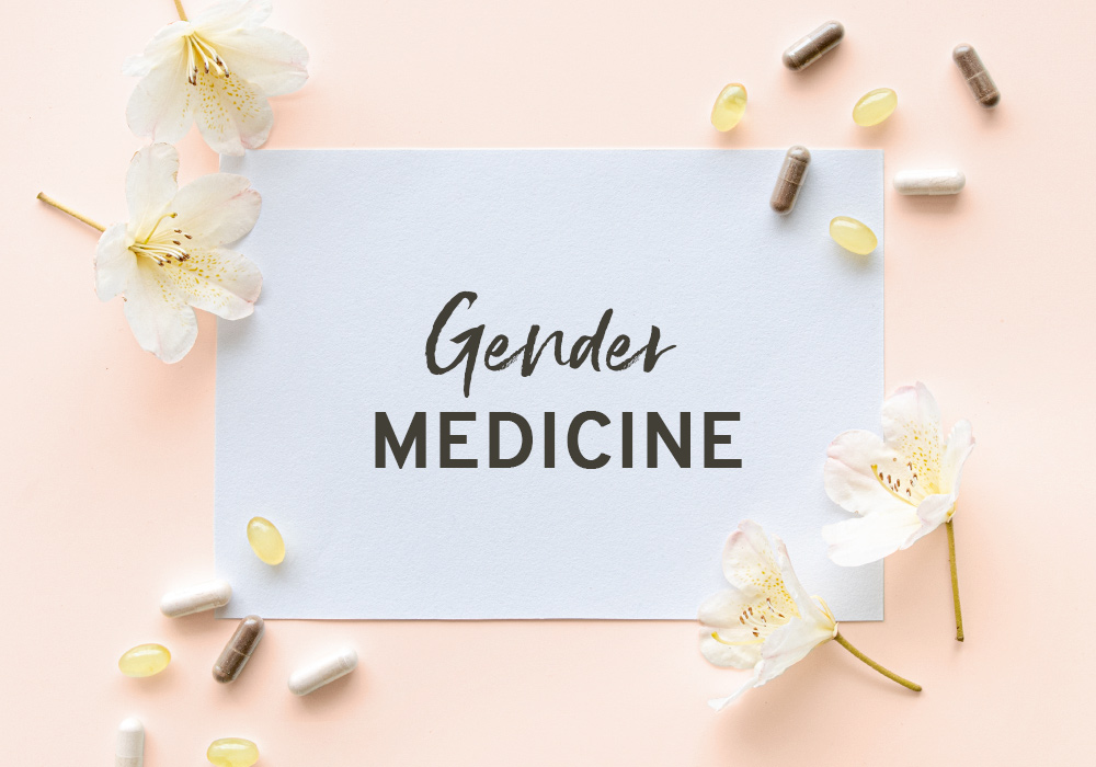 Das Wort Gendermedizin auf einem weißen Blatt vor rosa Hintergrund